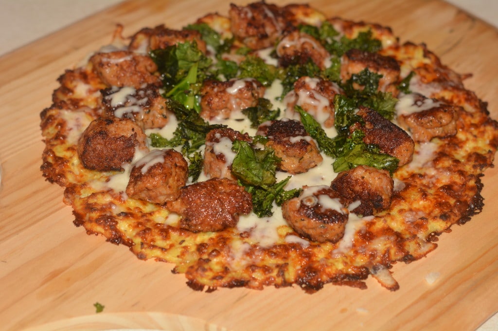 cauliflower pizza with sausge and kale chips