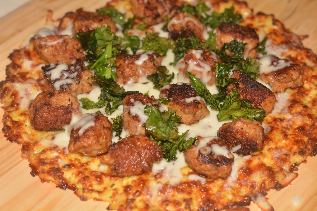 cauliflower pizza with sausge and kale chips