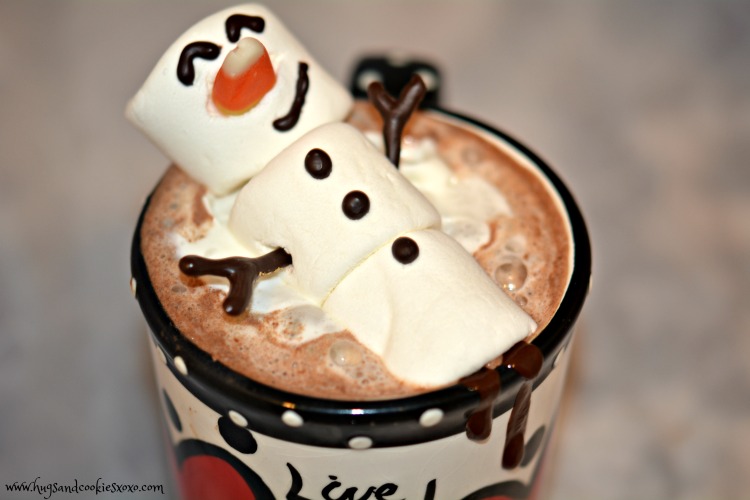 Snowman enjoying hot chocolate in the snow on Craiyon