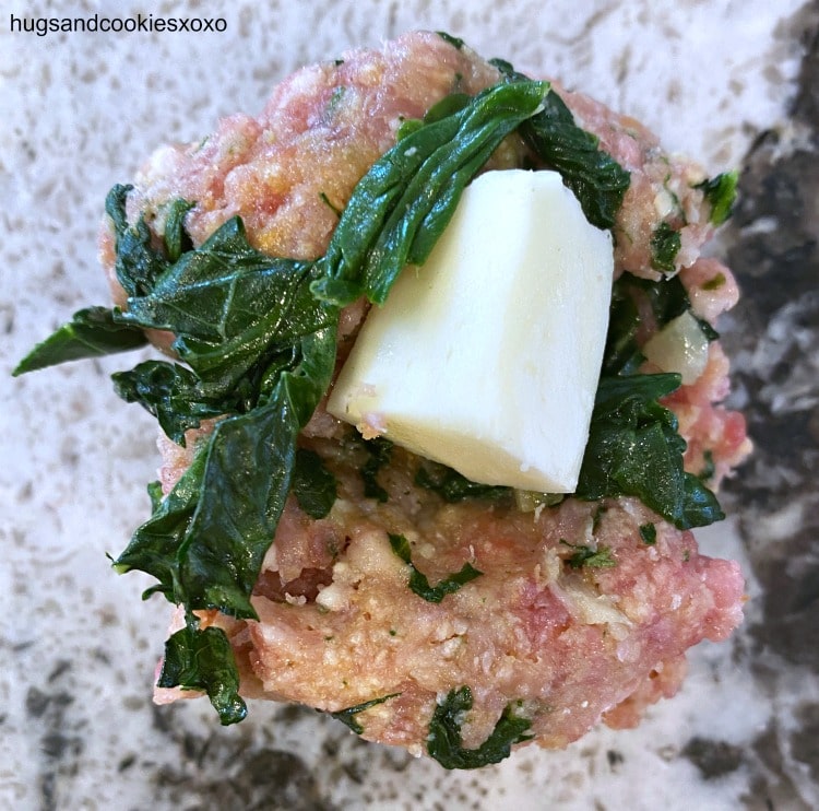 stuffing meatballs with mozzarella cheese