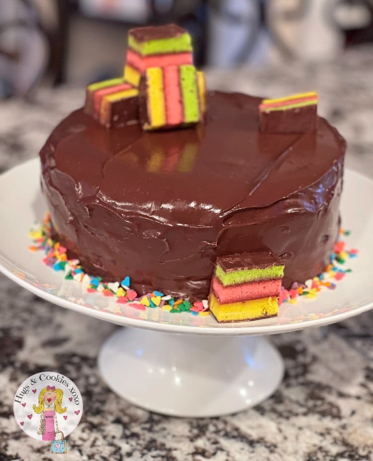 Chocolate Glazed Rainbow Cookie Cheesecake