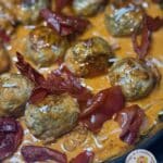 Pesto Meatballs in Sundried Tomato Sauce and Crispy Prosciutto